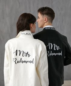 two people standing next to each other wearing jackets that say mr and mrs richmond on them