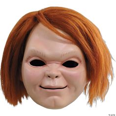 a creepy doll with red hair and black eyes has an orange wig on it's head