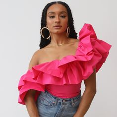 Designed to make a statement, this show-stopping top exudes opulence and style. The asymmetrical silhouette highlights your shoulder and collarbone, while the dramatic ruffles add the perfect unique touch. This attention-grabbing design promises to turn heads in the best of ways. Embrace the extraordinary and exude confidence with our one-shoulder dramatic ruffle top, because sometimes, being extra is just right. Runs small- size up Model is wearing her normal size small Made of 100% Cotton No s One Shoulder Top Outfit, Fluffy Clothes, Ruffle Tops Outfit, Shoulder Tops Outfit, Off Shoulder Ruffle Top, One Shoulder Ruffle Top, Being Extra, Statement Blouse, Sleeve Ideas