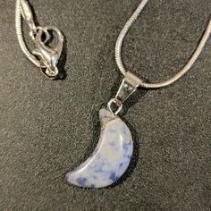 Sodalite Crescent Moon Chakra Pendant On 18" 925 Silver Plated Snake Chain. Sodalite Chakra Helps With Mental Clarity, Meditation, Self Awareness And Self Expression, Communication, And Brings Good Luck And Wealth. Sodalite Assist In Determining Your Life's Purpose And Direction In Life. It Integrates Logic And Intuition. Silver Moon-shaped Crystal Necklaces With Gemstone, Silver Moon-shaped Crystal Necklace With Gemstone, Sterling Silver Pendant Crystal Necklace With Moon Charm, Silver Crescent Necklace With Natural Stones, Celestial Silver Crystal Necklaces For Healing, Celestial Style Silver Necklace With Natural Stones, Silver Moon-shaped Necklace With Natural Stones, Sterling Silver Crystal Pendant Necklace With Moon Charm, Celestial Sterling Silver Necklaces With Natural Stones