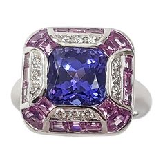 Tanzanite 3.36 carats with Pink sapphire 2.61 carats and Diamond 0.14 carat Ring set in 18 Karat White Gold Settings Width: 1.6 cm Length: 1.6 cm Ring Size: 53 Total Weight: 10.61 grams "We first opened doors in 1980 when it was then situated in the vicinity of the Victory Monument; a small and modest storefront with a couple of counters. From its humble beginnings to where it stands today, our company has proven its abilities as a jeweler. Since the beginning, we have been supplying fine qualit Luxury Brilliant Cut Sapphire Gemstones, Luxury Multi-stone Pink Sapphire Ring, Luxury Purple Rings Gia Certified, Luxury Purple Gia Certified Rings, Luxury Pink Sapphire Ring With Brilliant Cut, Luxury Sapphire Gemstones With Round Cut, Luxury Sapphire Gemstones With Accent Stones, Luxury Multi-stone Sapphire Gemstones, Luxury Pink Sapphire Ring For Formal Occasions