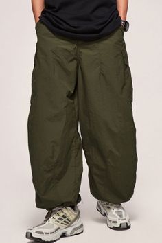 Price: $42.00 Material: 40% Nylon + 60% Polyester Size: S, M, L, XL, 2XL Color: Black, Army Green Applicable Season: Spring, Summer Green Cargo Style Wide-leg Parachute Pants, Baggy Military Pants With Cargo Pockets, Baggy Combat Full-length Bottoms, Combat Style Wide Leg Bottoms With Cargo Pockets, Military Cargo Bottoms Full Length, Combat Style Wide-leg Bottoms With Cargo Pockets, Combat Style Relaxed Fit Bottoms With Side Pockets, Military Cargo Style Full Length Bottoms, Baggy Full-length Combat Bottoms