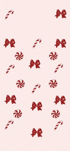 candy canes with bows on pink background