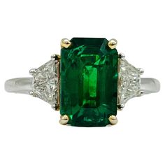 Beautiful 2.80 ct. Zambian emerald emerald cut with two good quality white diamond trapezoids. Handmade in 18k yellow and white gold. Ring size 7. GIA certificate included. Diamond Three Stone Ring, Gia Certificate, White Gold Set, Three Stone Ring, Zambian Emerald, Colombian Emeralds, Orange Sapphire, Modern Ring, Emerald Stone