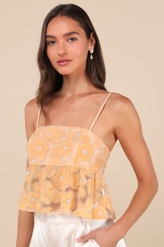 Send a sweet and sunny message when you step out in the Lulus Ideal Attitude Yellow Applique Beaded Floral Cropped Tank Top! Lightweight woven mesh boasts a darling design of textured applique flowers, surrounded by silver beads and decorated with faux pearl centers. Adjustable spaghetti straps support a bodice with a straight neckline and a flattering seamed bust. Sheer peplum trim falls to a cropped mini hem to finish this adorable top! Exposed zipper/clasp at back. Fit: This garment fits true Summer Lace Tops With Sequins, Summer Lace Top With Sequins, Summer Sequin Lace Top, Sequin Lace Top For Summer, Yellow Top For Spring Wedding, Yellow Spring Wedding Top, Summer Party Tops With Floral Applique, Yellow Lace Tops For Summer, Summer Embellished Lace Top