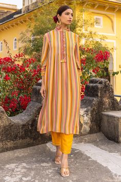 Mustard georgette kurta with multi-colored striped print and hand embroidered front placket and sleeves. Comes with trousers.
Components: 2
Pattern: Printed, Hand embroidered
Type Of Work: Striped
Neckline: Mandarin collar
Sleeve Type: Three quarter
Fabric: Georgette, Lining : Cotton
Color: Yellow, Multi Color
Other Details: 
Attached lining
Occasion: Mehendi and Haldi,Sangeet - Aza Fashions Elegant Multicolor Palazzo Set With Printed Motifs, Elegant Multicolor Silk Palazzo Set, Elegant Multicolor Georgette Palazzo Set, Elegant Multicolor Palazzo Set With Resham Embroidery, Elegant Multicolor Summer Palazzo Set, Elegant Multicolor Kurta For Spring, Elegant Multicolor Spring Kurta, Elegant Multicolor Straight Kurta, Suits Design Latest