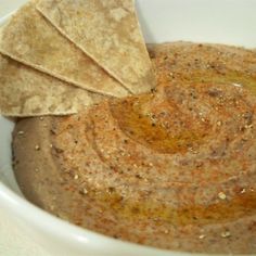 a white bowl filled with tortilla chips