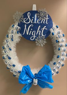 a blue and white wreath that says silent night