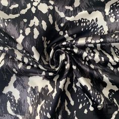 This posh silk/cotton satin is a black and white color. Unique for the extremely smooth and soft to the touch cotton/silk composition, this gorgeous print is fierce, fun, and refined. A popular choice for gowns, statement jackets, stand-out skirts and more. This fabric is not sheer, therefore a lining is not needed unless additional structure and modesty is desired. SKU: 6846 Content: Silk/Cotton Blend Color: Black And White Width: 58 inches Origin: Italy Note: this fabric is featured in a red c Statement Jackets, Hexagon Print, Jaguar Print, Statement Jacket, Fashion District, Black And White Fabric, Black And White Color, Black Sand, Nyc Fashion