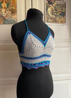 "Very pretty summer top with lacy band, picot edging and decorative ties. Made from 50% cotton and 50% viscose yarn for summer comfort. Approximately a UK 6-8, it will fit a minimum under bust measurement of 24\" and a maximum under bust measurement of 28\".The ties at the neck and the back laces adjust for a good fit. Gentle machine wash at 30 degrees and air dry. This is a totally unique top made to my own design." Summer Gray Cotton Crop Top, Bra-friendly Sleeveless Festival Top, Festival Bra Friendly Cropped Top, Bohemian Cami Crop Top For Beach, Purple Crochet Top For Summer Festival, Bohemian Fitted Cami Crop Top, Fitted Bohemian Cami Crop Top, Purple Bohemian Crop Top For Summer, Bohemian Purple Crop Top For Beach