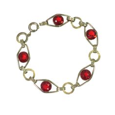 1930s Gold over sterling red crystal bracelet. Diamond-shaped open-back links w/ collet-set faceted ruby-red crystals, alternating w/ flattened circular links etched w/ a Greek key design. The gold surface is warm and inviting, the ruby crystals are vivid and resonant. A graceful, elegant, and eminently wearable beauty. Antique Red Bracelet For Formal Occasions, Red Antique Bracelet For Formal Occasions, Vintage Jeweled Jewelry With Round Beads, Vintage Red Gemstone Bracelets, Antique Jeweled Red Jewelry, Red Faceted Jewelry For Formal Occasions, Formal Red Faceted Jewelry, Red Jeweled Jewelry For Evening, Formal Metal Bracelets With Round Beads