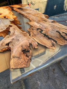 the table is made out of wood and has been turned into a piece of glass