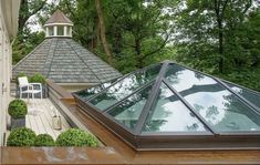 the roof of a house with a gazebo in the background