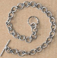 Antiqued Sterling silver fancy link bracelet with toggle clasp 71/2 inchesLinks size:4X6mm Toggle size:10mm round X 12.5mm long Metal Link Jewelry With Clasp, Metal Link Chain Bracelet With Toggle Clasp, Elegant Silver Round Toggle Necklace, Silver Rectangular Link Rolo Chain Jewelry, Classic Metal Chain Bracelet With Toggle Clasp, Classic Metal Charm Bracelet With Sterling Silver Clasp, Silver Charm Bracelet With Rolo Chain Links, Silver Elegant Toggle Necklace For Jewelry Making, Metal Link Charm Bracelet With Lobster Clasp