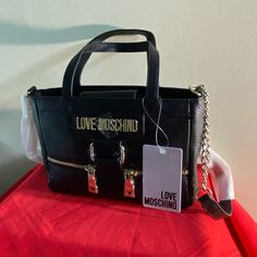 Love Moschino Nwt Leather Crossbody Bag. Snap Closure, Gold Tone Hardware, Adjustable Strap. Slip Pocket And Zip Pocket Interior. Size 8.5 X 2.5 X 6.5 Evening Satchel With Logo Hardware, Chic Crossbody Bag With Logo Hardware, Chic Crossbody Shoulder Bag With Logo Hardware, Shopping Crossbody Shoulder Bag With Logo Hardware, Shopping Satchel Bag With Logo Hardware, Black Bucket Bag, Moschino Bag, Moschino Bags, Red Crossbody Bag