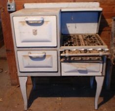 an old fashioned stove with two ovens on it