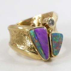 Tufa Cast 14k Gold Ring with a Curved Band and Featuring Natural Australian Opal from the Coober Pedy Mine, Sugilite, and a .25 Carat Diamond. Ring Size: 7.5” Setting Width, .625” Setting Height.375” Band Width Silver Rings With Inlay For Collectors, Unique Sterling Silver Opal Ring With Inlay, Modernist Inlay Jewelry As Gift, Luxury Silver Opal Ring With Inlay, Unique Sterling Silver Opal Inlay Ring, Tufa Casting, 14k Gold Ring, Australian Opal, Gold Rings