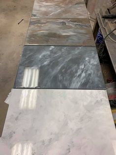 marble counter tops are lined up on the floor