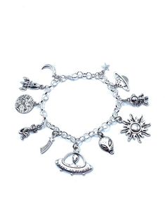 New. This Bracelet makes a perfect gift. Has  11 Alien UFO Themed Charms all charms are approx 1/2" to 1" in size Stainless Steel bracelet has a lobster clasp closure and is adjustable measures approx 8" bracelet is Stainless Steel  charms are silver tone alloy and steel. (Nickel and lead free) Nickel-free Adjustable Space-themed Jewelry, Novelty Charms Bracelet Jewelry, Novelty Jewelry Charms Bracelet, Adjustable Novelty Charm Bracelet, Adjustable Novelty Charm Bracelet With Lobster Clasp, Adjustable Symbolic Metal Charms, Nickel Free Novelty Bracelet Jewelry, Symbolic Adjustable Nickel-free Charm Bracelet, Adjustable Themed Charms Jewelry