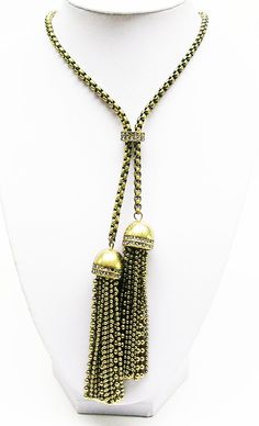 Finished in  Antique  gold  tone, signed, Gold Metal Jewelry With Tassels, Gold Metal Tassel Jewelry, Adjustable Gold Tassel Necklace With Fringe, Gold Tassel Dangle Necklace Gift, Gold Dangle Lariat Necklace For Parties, Gold Metal Long Lariat Necklace, Adjustable Metal Dangle Tassel Necklace, Bohemian Gold Drop Necklace With Adjustable Chain, Adjustable Metal Tassel Dangle Necklace