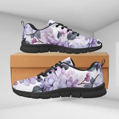 These Women's Breathable Sneakers (Model 055) feature a striking and elegant floral design, with vibrant lilac flowers blooming across the shoes. The pattern showcases a harmonious blend of soft lavender, deep violet, and delicate pink hues, creating a visually stunning contrast against the darker green and black leaves. The floral motif wraps around the entire shoe, giving it an artistic and feminine touch that is both modern and timeless. The intricate detailing of the flowers, including the r Purple Sneakers With Round Toe For Spring, Purple Round Toe Sneakers For Spring, Purple Sneakers For Sports In Spring, Purple Slip-on Sneakers For Spring, Custom Purple Lace-up Sneakers With Cushioned Footbed, Purple Lace-up Custom Sneakers With Cushioned Footbed, Custom Purple High-top Sneakers With Cushioned Footbed, Lilac Watercolor, Pink Floral Print Slip-on Sneakers