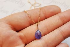 Genuine Purple Dainty Tanzanite Gemstone Necklace, December Birthstone Jewelry, Authentic Tanzanite Jewelry, 14k Gold Tanzanite Necklace This dainty necklace features a genuine faceted purple Tanzanite gemstone wire wrapped on a delicate yet sturdy dainty chain. This stone measures at 8x6x5mm and also comes gift wrapped for free. Perfect gift for any lady who loves purple tanzanite or born in December. Materials - your choice of sterling silver, 14k gold filled, 14k rose gold filled and genuine Purple Tanzanite, Born In December, December Birthstone Jewelry, Tanzanite Necklace, Tanzanite Jewelry, Dainty Chain, Tanzanite Gemstone, December Birthstone, Dainty Necklace