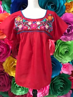 BLOUSE ONLY Materials Popelina Only Mexican Blouse Tehuacan Womans  SIZE SMALL Long 26 Inches armpit to armpit 17 inches Look in our website www.mexicotodocorazon.com This is not included Accessories belts are not included SKIRT Coco Theme Party Wash cold - dry flat to maintain brilliant colors Note: All color embroidery is slightly different, every dress is handmade, so they are different from one another, as a result you will own a unique piece. You will receive the color you selected, only em Summer Beach Peasant Top With Floral Embroidery, Bohemian Multicolor Peasant Top For Summer, Floral Embroidered Peasant Top For Summer Beach, Folk Style Peasant Top For Beach, Hippie Red Top For The Beach, Red Bohemian Blouse For Summer, Multicolor Hippie Peasant Top For Summer, Multicolor Peasant Top For Summer Festivals, Bohemian Multicolor Short Sleeve Peasant Top