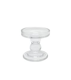 a clear glass candle holder on a white background