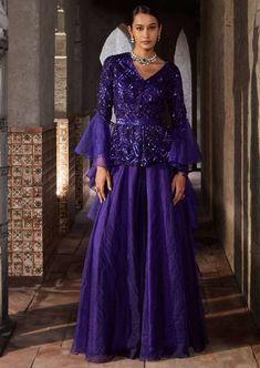 This gorgeous purple sharara with full sleeves has geometric embroidery with front open. It is paired with organza sharara. The outfit is completed with frill dupatta and belt. Organza Sharara With Long Sleeves For Reception, Party Organza Palazzo Set With Long Sleeves, Long Sleeve Organza Palazzo Set For Parties, Party Long Sleeve Organza Palazzo Set, Festive Purple Palazzo Set With Long Sleeves, Designer Long Sleeve Purple Palazzo Set, Festive Purple Palazzo Set For Party, Purple Long Sleeve Palazzo Set For Festive Occasion, Festive Purple Long Sleeve Palazzo Set