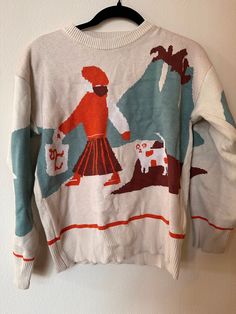 fantastic women's vintage sweater with a women walking a dog. no tag for sizing but fits like a women's medium. great condition. no visible staining or holes. beautiful statement piece. Retro Cotton Sweatshirt For Fall, Graphic Print Knit Sweater For Fall, Cozy Graphic Print Sweater For Winter, Cozy Graphic Print Winter Sweater, Fall Graphic Print Knit Sweater, Retro Cotton Sweater For Fall, Oversized Vintage Sweater With Graphic Print, Vintage Graphic Print Winter Sweatshirt, Vintage Style Oversized Sweatshirt