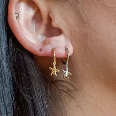 Unlock the celestial magic and let your style shine  ✨ Embrace the cosmic energy and let these earrings inspire wonder and connection to the universe.💫 Check what's cool about it 😎 🌙 Crescent moon, starfish, and star charms ✨ 18K gold vermeil over sterling silver 💫 Secure and comfortable huggie hoops ⭐ Unisex design 🎁 Charming packaging Something you must know... 👀 As part of our commitment to sustainable fashion and fair trade practices, we responsibly source our materials, focusing on hy Celestial Style Everyday Earrings, Celestial Hoop Earrings With Star Charm, Celestial Yellow Gold Tarnish-resistant Hoop Earrings, Celestial Pierced Huggie Jewelry, Celestial Huggie Pierced Jewelry, Celestial Hoop Earrings With Star Charm For Everyday, Celestial Gold Plated Tarnish Resistant Hoop Earrings, Celestial Gold-plated Tarnish Resistant Hoop Earrings, Celestial Small Hoop Jewelry With Star Charm