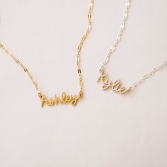 Escape to the Amalfi coast with our beautiful Amalfi Name Necklace! Its delicate design will turn heads and inspire confidence - making you feel like you can conquer anything! NECKLACE FEATURES Choice of 18k gold plating over sterling silver or Sterling Silver handcrafted custom name pendant (approx.* 1", up to 10 characters) Choice of Metal: Gold Fill or Sterling Silver Choice of Chain Style: Cable Chain or Upgraded Specialty Link Chain All necklace findings are gold filled/sterling silver. Eac Everyday Gold Name Necklace, Gold Name Necklace For Everyday Wear, Adjustable Nameplate Chain Necklace, Minimalist Adjustable Nameplate Necklace, Dainty Name Necklace With Delicate Chain For Her, Dainty Name Necklace With Delicate Chain As A Gift, Dainty Necklace With Adjustable Chain For Personalized Gift, Dainty Necklace With Adjustable Chain As Personalized Gift, Dainty Necklace With Delicate Chain For Personalized Gift