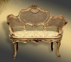 an ornately decorated bench is shown against a beige background with gold trimmings