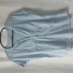 Lucky Brand Light Blue Tee With Two Pockets At The Front Chest Area. Linen Type Woven Fabric At Front From The Pockets Down With Cotton Modal Tee At Top And Back Of Shirt. Button Placket In Front. Laundered But Never Worn. Made Of 60% Cotton And 40% Modal. Woven Part Of Tee Is 100% Cotton. Blue Cotton V-neck Shirt, Blue Button-up Blouse For Everyday, Everyday Blue Button-up Blouse, Casual Light Wash V-neck Top, Light Blue Casual V-neck Shirt, Casual Light Blue V-neck Shirt, Relaxed Fit Light Wash Top With Buttons, Light Wash Relaxed Fit Top With Buttons, Casual Blue Buttoned Blouse