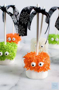 halloween marshmallows with googly eyes and spider web on them