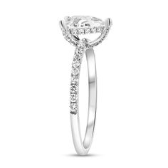 a white gold engagement ring with an oval cut diamond