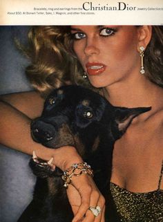 a woman holding a black dog in her lap with the caption fetching is your dor