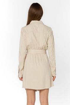 Add some sophistication to your wardrobe with the Deena Dress. This soft mini shirtdress features a stylish collar and snap button closure. With long sleeves and functional pockets, it's both practical and trendy. Complete the look with the self-belt for a flattering fit. Material: 60% Tencel™ and 40% Linen Machine wash cold or dry clean Color: Wheat Model is 5'9" and wearing a size S Imported Fitted Collared Belted Dress With Buttons, Belted Fitted Shirt Dress For Fall, Fitted Belted Shirt Dress For Fall, Fitted Button-up Belted Dress For Fall, Chic Collared Belted Fitted Dress, Chic Collared Fitted Belted Dress, Fall Fitted Button-up Belted Dress, Chic Fitted Collared Belted Dress, Spring Collared Shirt Dress With Roll-up Sleeves