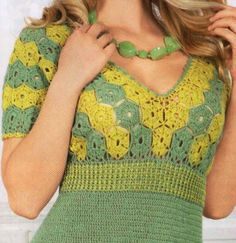 a woman wearing a green and yellow crochet top with flowers on the chest