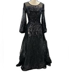 Mac Duggal Long Sheer Sleeve Jewel Sequin Beaded Gown - Black - Size 4 Of Note: - There Are Quite A Few Bead Strings On The Left Shoulder Missing. The Best Option I See Is To Remove The Bead Strings On The Right Shoulder, As There Aren't Enough Beads To Recreate The Look On The Left Side. - This Is A Significant Gown, Featuring Four Layers, Two Of Which Are Tulle. - This Gown Is Covered In Sequins And Beads. I'm Sure There Are A Few Missing Here And There, But No Large Patches Of Missing Sequins Black Fitted Sequin Dress For Wedding, Evening Gown With Contrast Sequin For Prom, Contrast Sequin Evening Gown For Prom, Black Embellished Long Sleeve Gown, Black Sequin Dress For Wedding Gala, Black Long Sleeve Embellished Gown, Black Evening Mother Of The Bride Dress For Wedding, Black Mother Of The Bride Dress For Evening Wedding, Evening Sequin Dress With Embellished Fitted Bodice