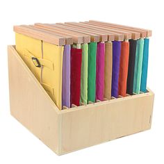 a wooden box filled with lots of different colored folders