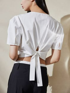 Elegant Linen Top With Tie Back, Elegant Linen Tops With Tie Back, Elegant Linen Tie Back Tops, Chic Cotton Blouse With Tie Back, Elegant White Blouse With Tie Back, Elegant White Tie Back Blouse, Spring Workwear Blouse With Tie Back, Spring Tie-back Blouse For Work, Elegant Tops With Tie Straps For Day Out