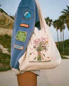 "Gift Giving" Embroidered Tote Bag Dandy Worldwide, Painted Tote, Cotton Plant, Embroidered Tote Bag, Autumn Fits, Embroidered Tote, Clothing Designs, Cute Tote Bags, Sweatpants Set