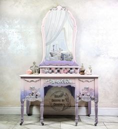 an old fashioned vanity with a mirror on it's top and drawers underneath the dresser