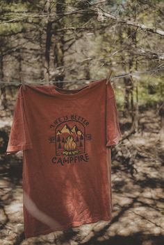 Life is better by the campfire graphic t-shirt. Each t-shirt is pressed house on a comfort colors unisex shirt. T-shirts are made of a soft cotton blend and features a vibrant direct to fabric transfer design that won't fade or crack. COLOR PICTURED: YAM Shop our wanderlust inspired t-shirt collection. Perfect for those who enjoy hiking, camping, exploring the outdoors and all adventure seeking enthusiasts. keywords: wanderlust t-shirt, adventure t-shirts, graphic tees, unisex outdoorsy shirts, Camp Clothing, Camping Tee Shirts, Outdoorsy Shirt, Hiking T Shirt, Camp Aesthetic, Camp Shirts, Camping Style, Hiking Tshirt, Earthy Outfits