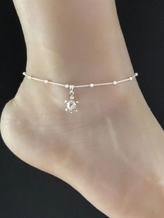 "Sterling Silver Turtle Anklet Minimalist and Dainty Rolo Beaded Hatching Turtle Ankle Chain ANKLET FEATURES: Metal: All components are made from solid .925 Sterling Silver Model is wearing 10\" in length solid .925 Sterling Silver Rolo Bead Chain Chain Length: 9 inch + 1 inch extension Your Dainty Rolo Beaded Turtle Anklet will arrive in a gift box, beautifully wrapped and ready for gifting Please send me a message if you have any questions before or after placing your order. Please also view m Dainty Adjustable Nickel-free Anklets, Adjustable Hypoallergenic Silver Anklet, Adjustable Dangle Anklets With Chain, Beaded Turtle, Turtle Anklet, Wedding Anklets, Baby Sea Turtle, Beaded Ankle Bracelets, Beautiful Anklet