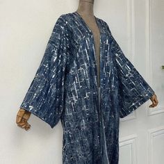 Length: 58 inches Size: One size fits S-4X Material: Denim chambray Details: Stunning sequined accents Versatile and stylish Perfect for adding a touch of sparkle to any outfit This denim sequined kimono combines the casual appeal of denim with the glamor of sequins, making it a standout piece in your wardrobe. Wear it over any outfit for an effortlessly chic look. One Size Fits Most Size Chart Blue Contrast Sequin Fabric For Spring, Blue Sequin Fabric With Contrast Sequin For Spring, Blue Sequin Fabric With Contrast Design For Spring, Spring Blue Embellished Sequin Fabric, Turks And Caicos Islands, Stardust, Wear It, Trinidad And Tobago, Chambray