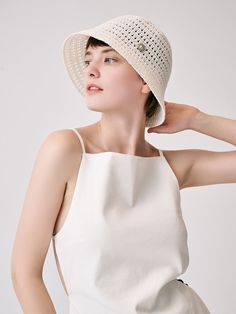 Editor's Notessieor presents unique and stylish hats that add a cute accent to your look. - Bucket hat style- Bell shape- Raffia and cotton blend- Vintage button embellished- Classic and trendy mood Measurements (in.)One Size- Depth: 8.27 in.- Circumference: 23.62 in. Composition & Care- Material: 50% Raffia, 50% Cotton- Avoid direct heat and moisture- Natural dry in the shade if wet- Do not bleach- Do not iron- Do not dry clean- Please refer to the care label Designer- b Chic White Flat Brim Boater Hat, White Chic Boater Hat With Flat Brim, Chic White Boater Hat With Flat Brim, White Cotton Vacation Hat, Chic Wide Brim Bucket Hat, Elegant White Bucket Hat, White Cotton Sun Hat With Short Brim, White Wide Brim Cotton Sun Hat, White Cotton Brimmed Sun Hat