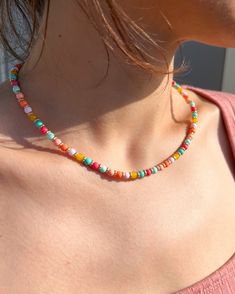 This beaded multicolor choker is a perfect brightening up any outfit. Dress it up for a more elegant night out, or wear it casually for a chic, beachy look. It can be a great gift for her or for yourself.  It has a lobster clasp closure and an extension chain allowing for easy adjustability and remove. Necklace Length: 17 inch (with 1 inch extender to make the necklace adjustable to 18 inches) Handmade Beaded Necklace Closure: Lobster Claw  Adjustable length Necklace Care: Avoid wearing in water or to sleep to keep the necklace in the best shape. Overtime, the clasp and chain may begin tarnish. Festival Letter Beads, Multicolor Spacer Beads Jewelry For Summer, Multicolor Beads For Summer Jewelry Making, Summer Multicolor Jewelry With Spacer Beads, Vacation Colorful Beads Choker, Colorful Beaded Necklaces With Letter Beads, Colorful Letter Beads Necklace, Multicolor Letter Beads For Summer, Trendy Multicolor Letter Beads Choker