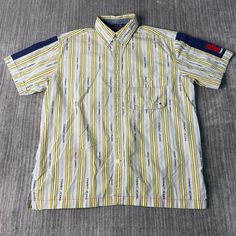 Vintage 2000s Tommy Jeans One Pocket Striped Pattern Basic Essential Streetwear Style Y2K Aesthetic Yellow Button Up Shirt Medium Mens Condition:  Excellent Used Condition  = No Flaws Measurements: Please see photos above for all measurements IF YOU BUY TWO OR MORE ITEMS USE THE CODE BUNDLE @ CHECK TO SAVE 20% WE SHIP WITHIN 24 HOURS AFTER PURCHASE! Please be aware that we do not offer free returns!! The Buyer is responsible for the cost of the return label.  Follow us on TikTok & Instagram @findsnostalgic and tag us in your finds Casual Button Shirt For Streetwear, Casual Streetwear Shirt With Buttons, 90s Collared Tops For Streetwear, Y2k Cotton Tops With Button Closure, 90s Style Collared Shirt With Button Closure, 90s Short Sleeve Tops With Button Closure, 90s Style Cotton Shirt With Buttons, 90s Style Button-up Shirt For Streetwear, 90s Style Cotton Collared Shirt